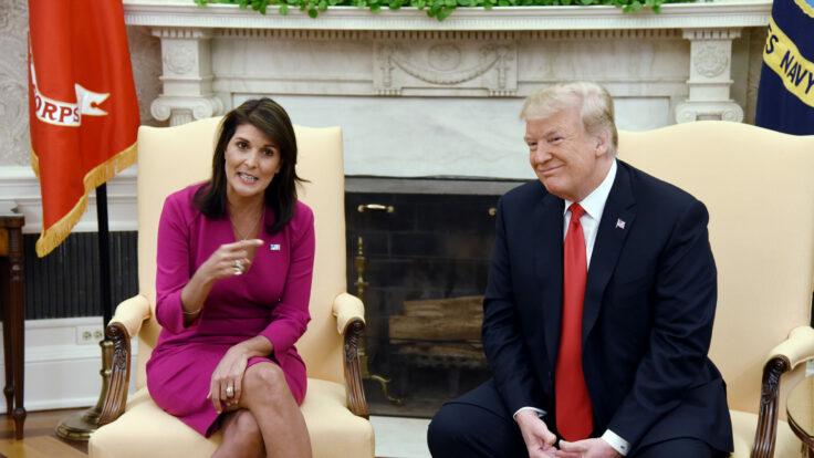 U.S. President Donald Trump meets with Nikki Haley, the United States Ambassador to the United Nations in the Oval Office on October 9, 2018.